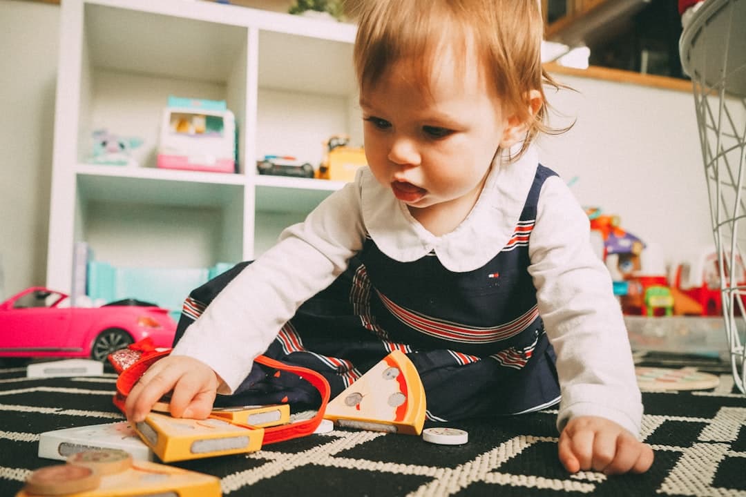 Toddler exploring in a bright playroom